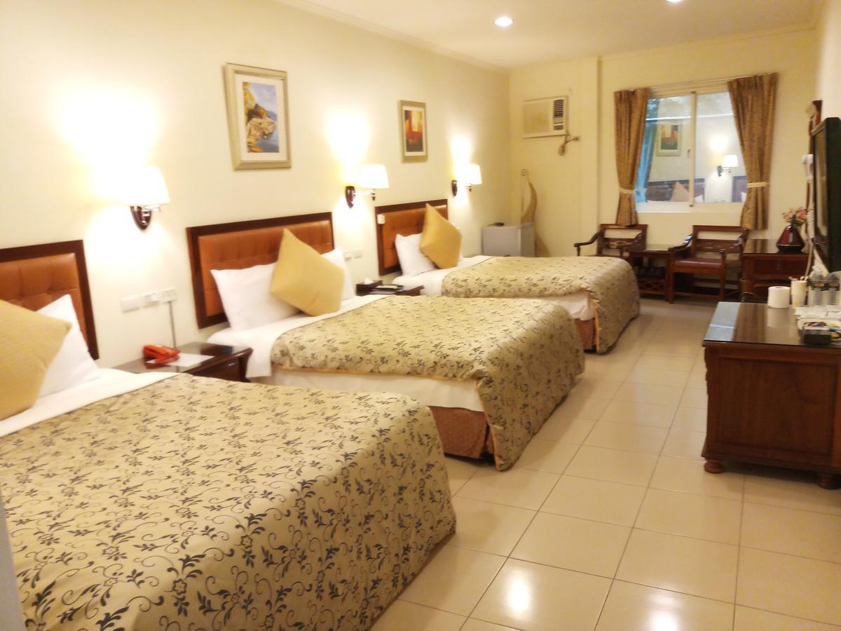 Puti Commercial Hotel Лонгтан Екстер'єр фото